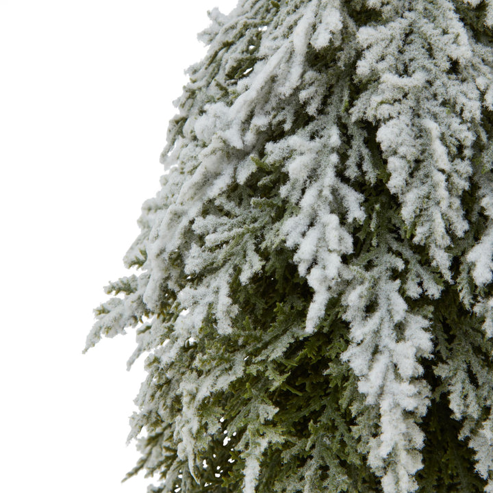 Small Snowy Fir Tree On Tall Wood Log